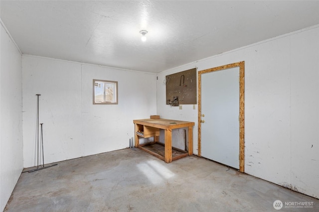 spare room with concrete flooring