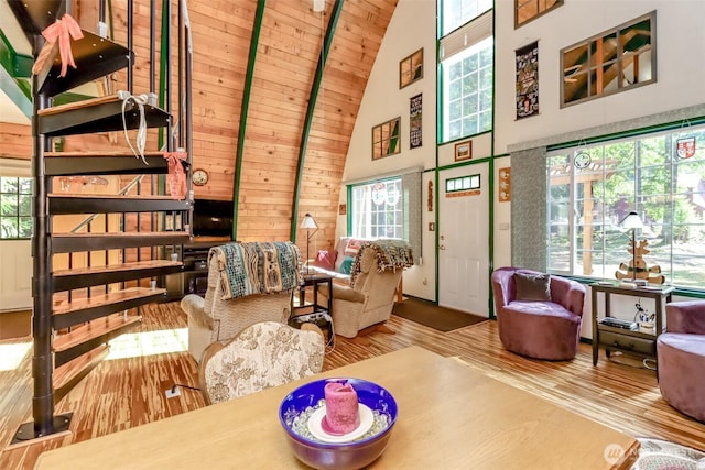 living room featuring wooden ceiling, high vaulted ceiling, and wood finished floors