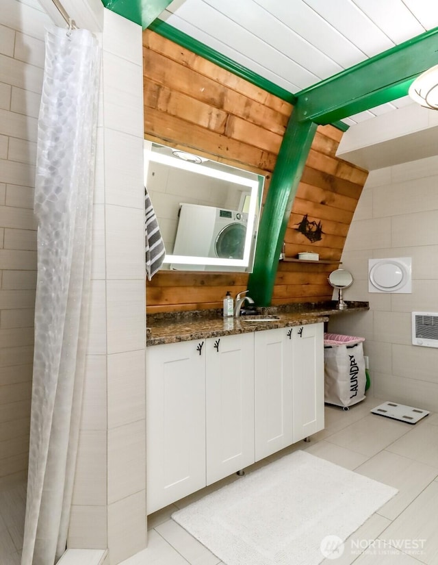 bathroom with vanity, tile patterned flooring, curtained shower, wooden ceiling, and beamed ceiling