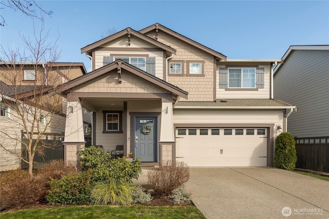 craftsman inspired home with concrete driveway and an attached garage