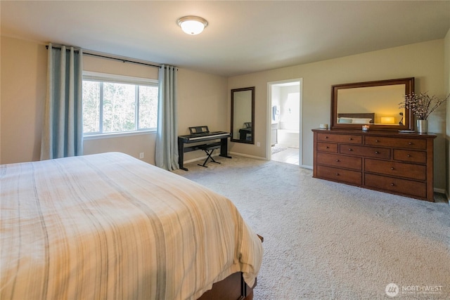 carpeted bedroom featuring baseboards