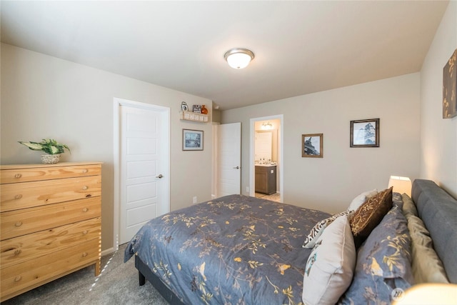 bedroom with carpet flooring and connected bathroom