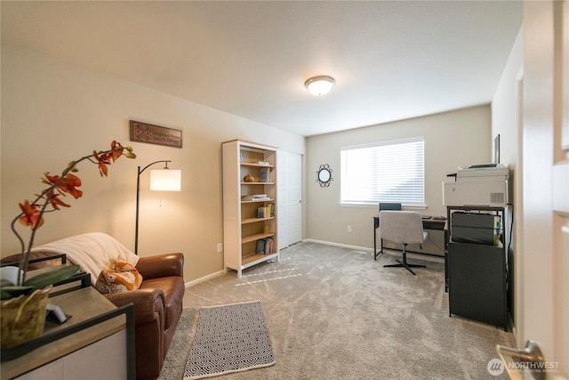 office with baseboards and light colored carpet