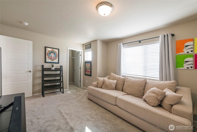 living area with carpet flooring and baseboards