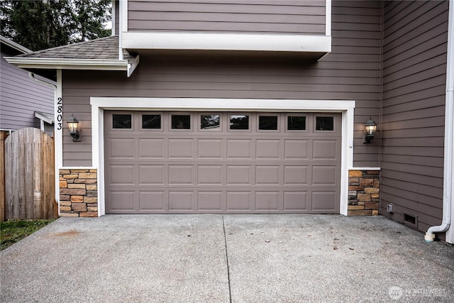 garage featuring driveway