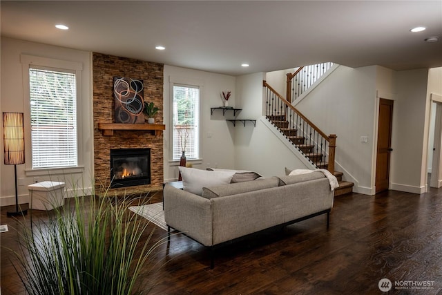 living area featuring stairway, recessed lighting, and dark wood-style flooring