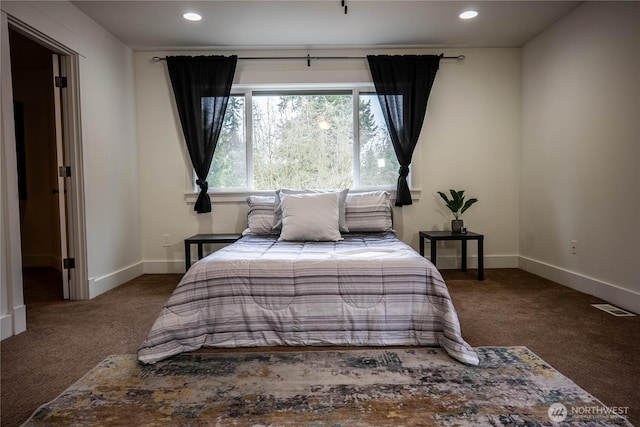 carpeted bedroom with recessed lighting, visible vents, and baseboards