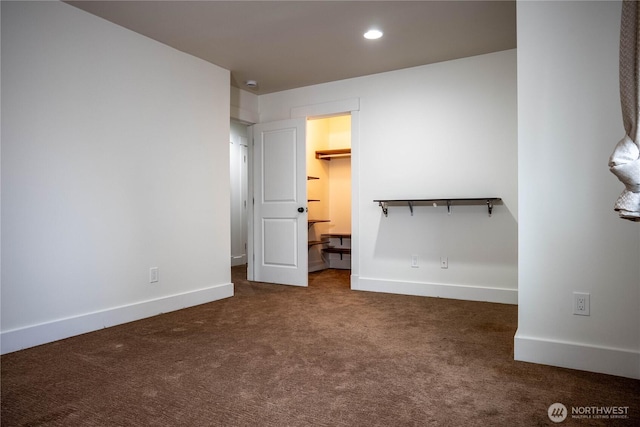 unfurnished bedroom featuring recessed lighting, baseboards, and carpet flooring