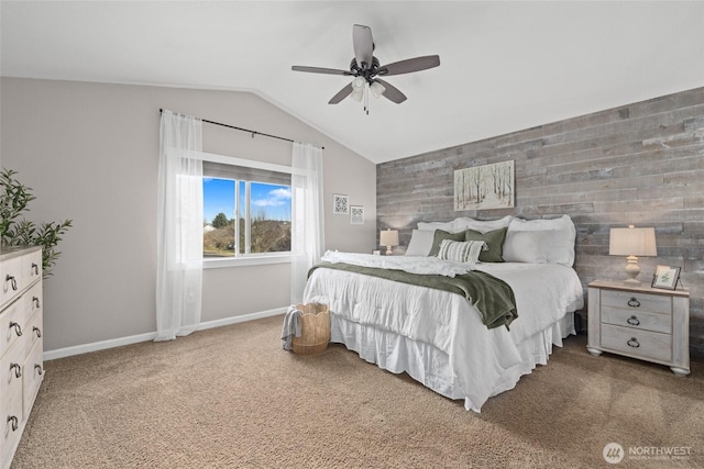 carpeted bedroom featuring baseboards, a ceiling fan, and vaulted ceiling