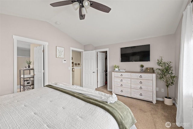 bedroom with baseboards, lofted ceiling, light colored carpet, and a ceiling fan