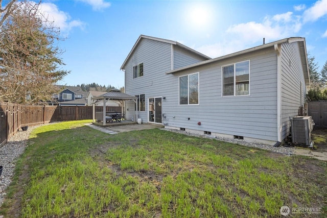 back of property featuring a patio, cooling unit, a fenced backyard, a gazebo, and a lawn