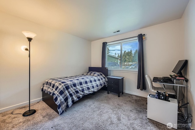 bedroom featuring visible vents, carpet floors, and baseboards