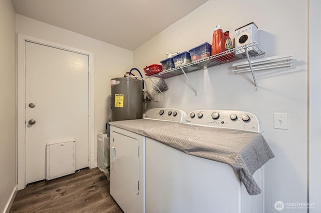 laundry area featuring electric water heater, washing machine and dryer, laundry area, and dark wood-style flooring