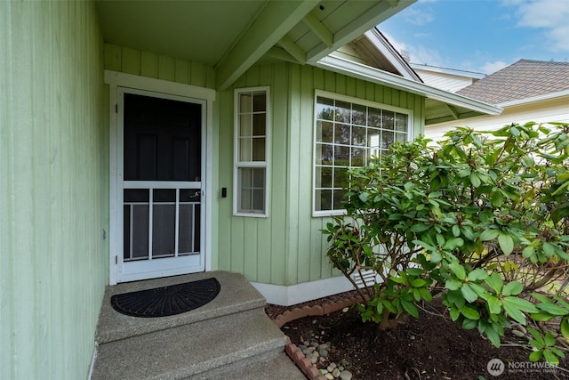 doorway to property with board and batten siding