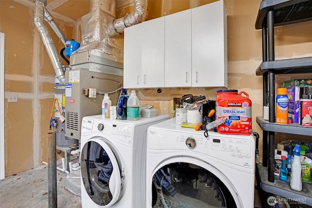 laundry room featuring cabinet space and separate washer and dryer