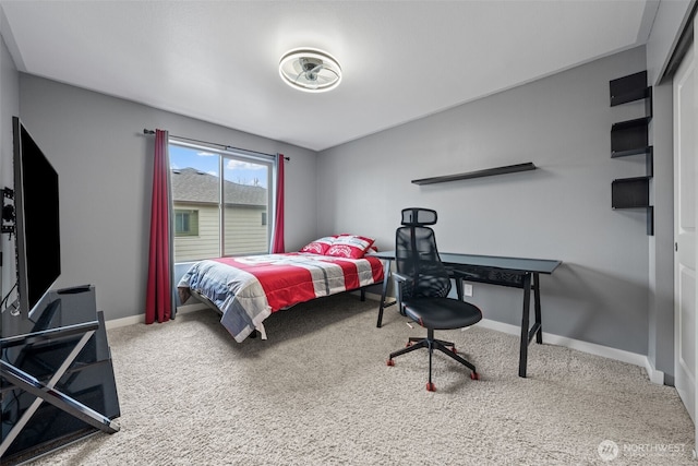 bedroom featuring baseboards and carpet floors