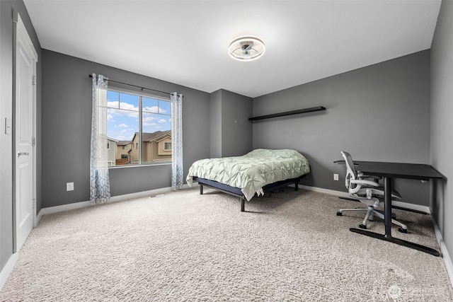 carpeted bedroom featuring baseboards