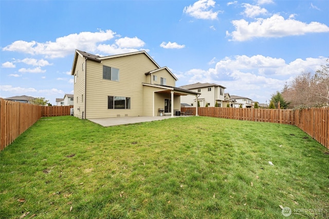 rear view of house featuring a patio area, a fenced backyard, and a yard