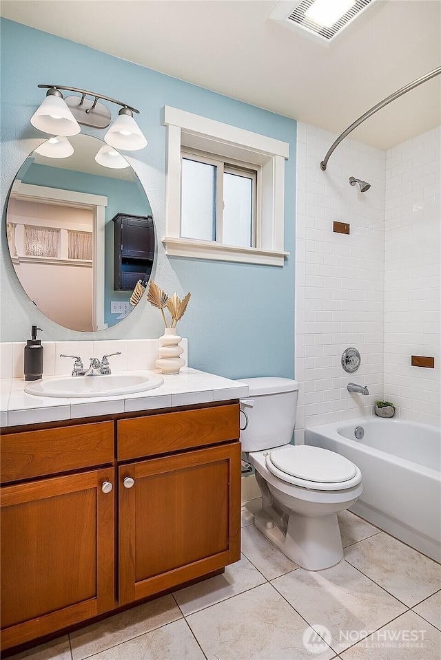 bathroom featuring visible vents, toilet, tile patterned flooring, bathtub / shower combination, and vanity