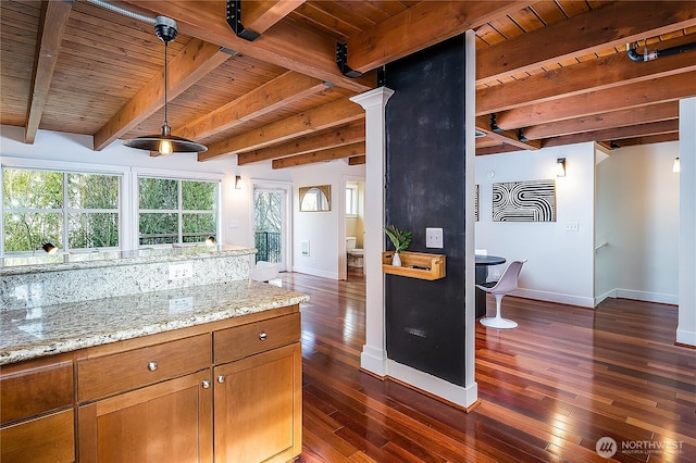 kitchen with dark wood-type flooring, brown cabinetry, wood ceiling, and baseboards