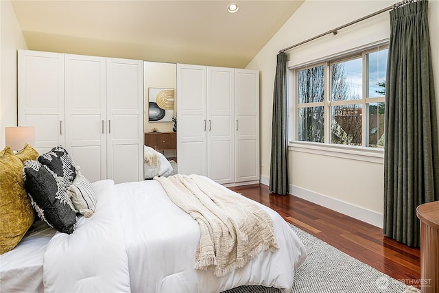 bedroom featuring dark wood-style flooring, recessed lighting, baseboards, and vaulted ceiling