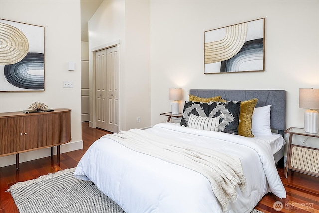 bedroom featuring wood finished floors and a closet