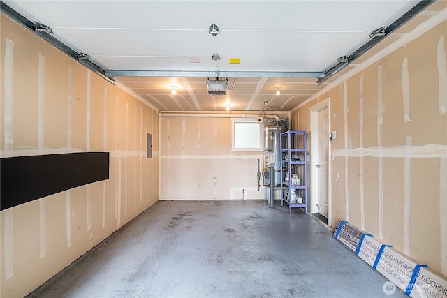 garage featuring electric panel, gas water heater, and a garage door opener