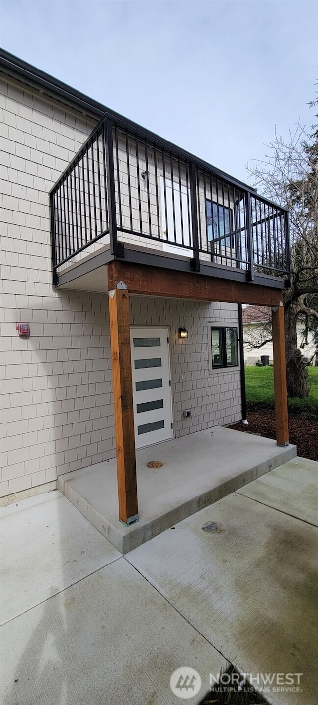 view of home's exterior featuring a balcony