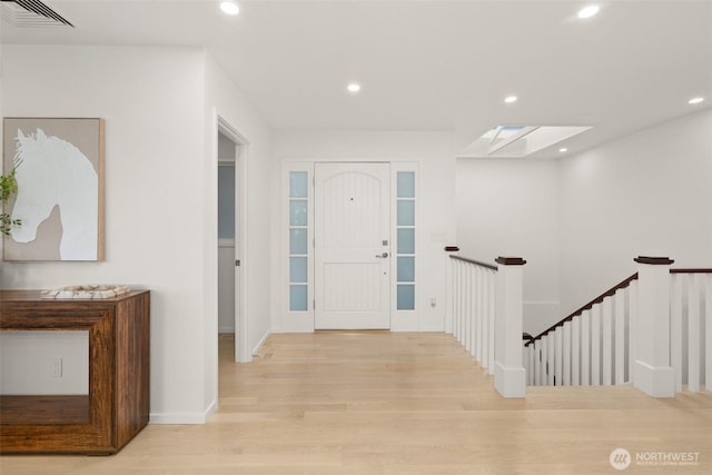 entryway featuring recessed lighting, visible vents, and wood finished floors