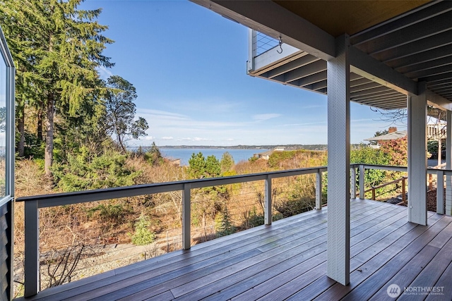 wooden deck featuring a water view