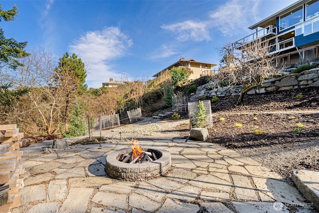 view of patio / terrace featuring an outdoor fire pit