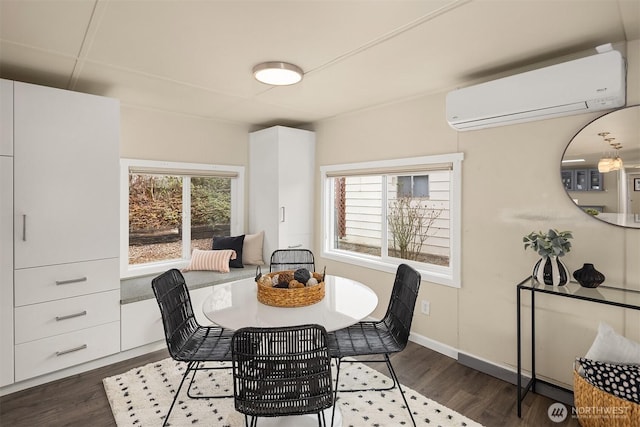 dining area featuring dark wood finished floors, a wall unit AC, and a healthy amount of sunlight