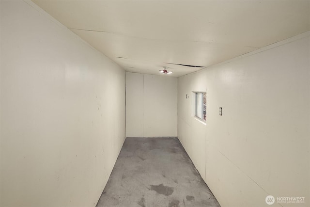 unfurnished room with concrete flooring