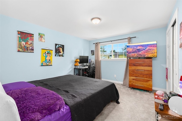 bedroom with carpet and baseboards