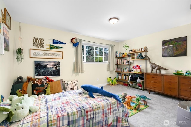 bedroom featuring light colored carpet and baseboards