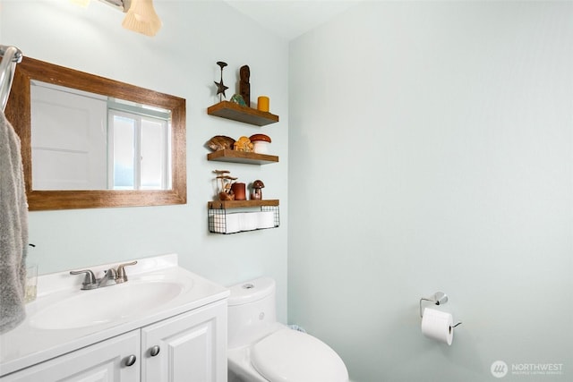 bathroom with vanity and toilet