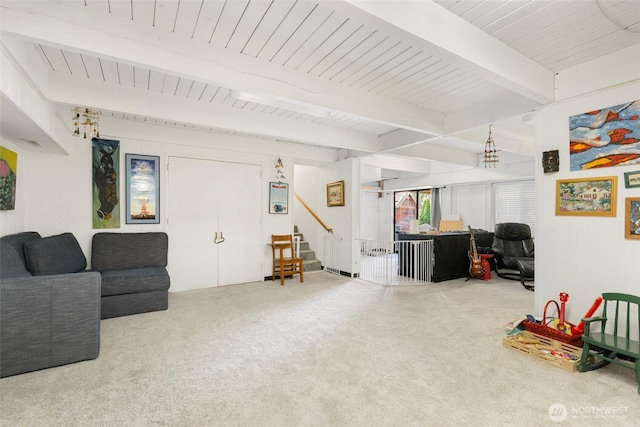 interior space with beamed ceiling, stairway, and wooden ceiling