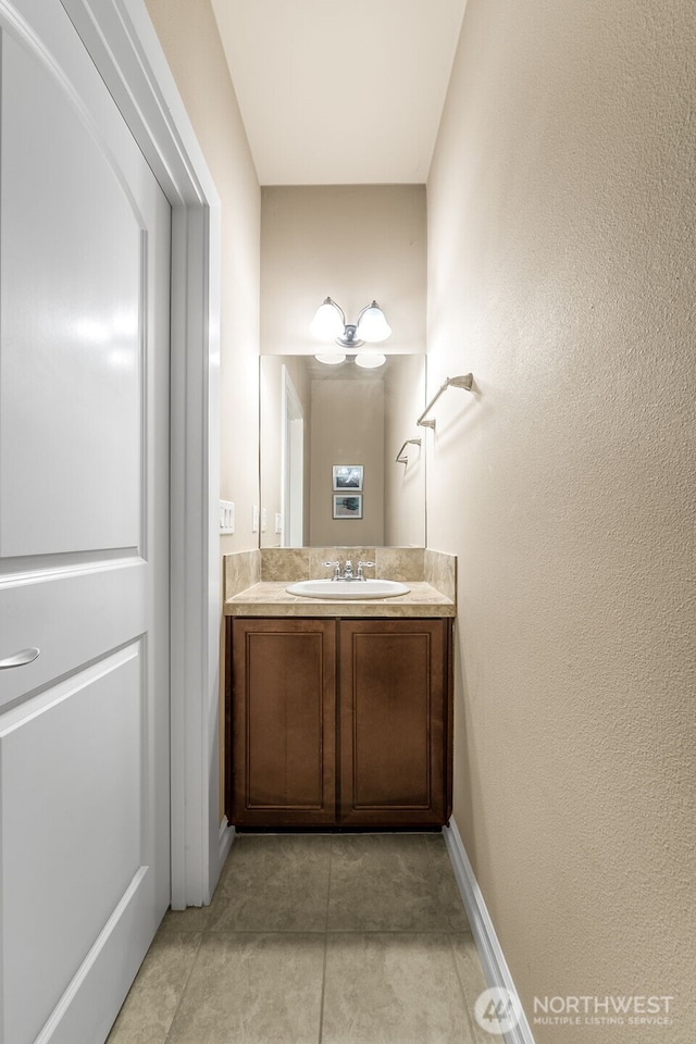 bathroom with vanity and tile patterned flooring