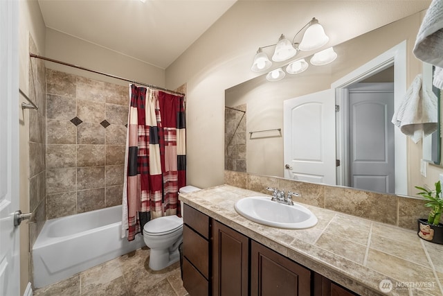 full bath with toilet, vanity, and shower / bath combo