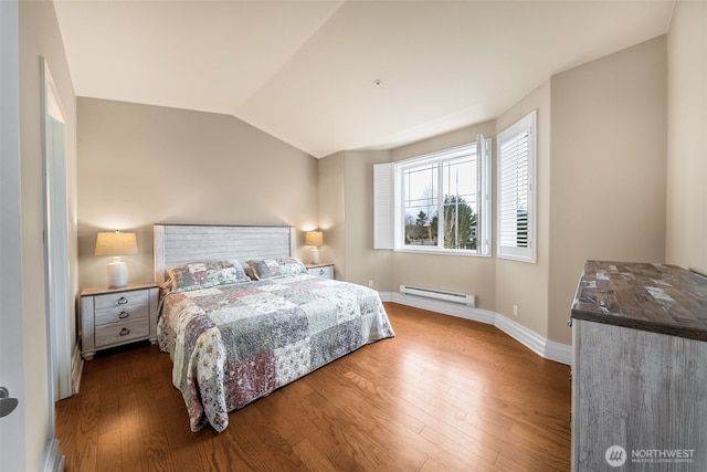 bedroom with a baseboard radiator, lofted ceiling, baseboards, and wood finished floors