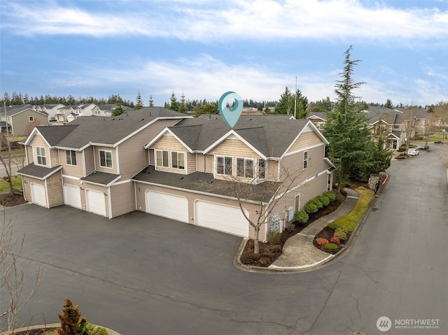 birds eye view of property with a residential view