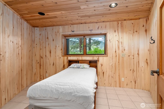 tiled bedroom with wooden ceiling and wooden walls