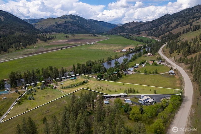 birds eye view of property with a rural view and a water and mountain view