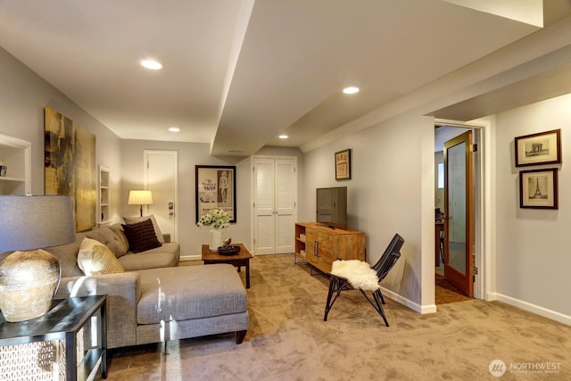 carpeted living room featuring recessed lighting and baseboards