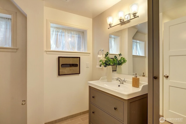 bathroom featuring vanity and baseboards