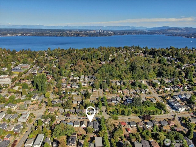 birds eye view of property with a residential view and a water and mountain view