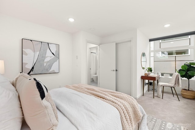 bedroom with recessed lighting and light colored carpet