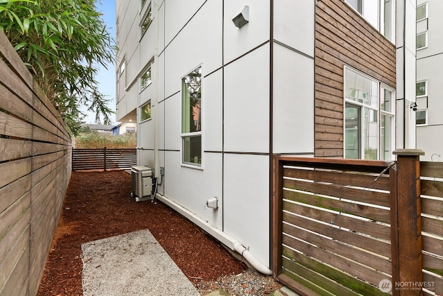 view of property exterior featuring fence