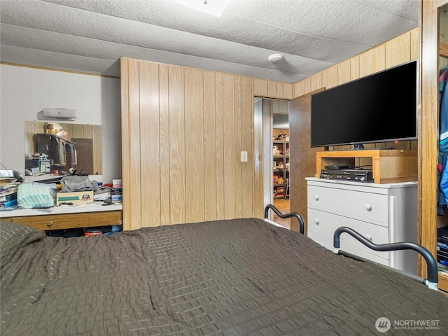 bedroom with wooden walls