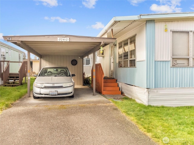 view of parking with a carport and concrete driveway